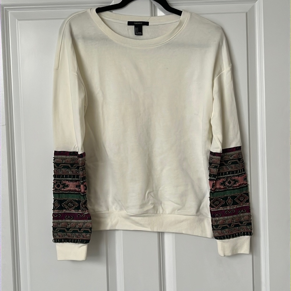 Cream sweatshirt with colored and beaded detail